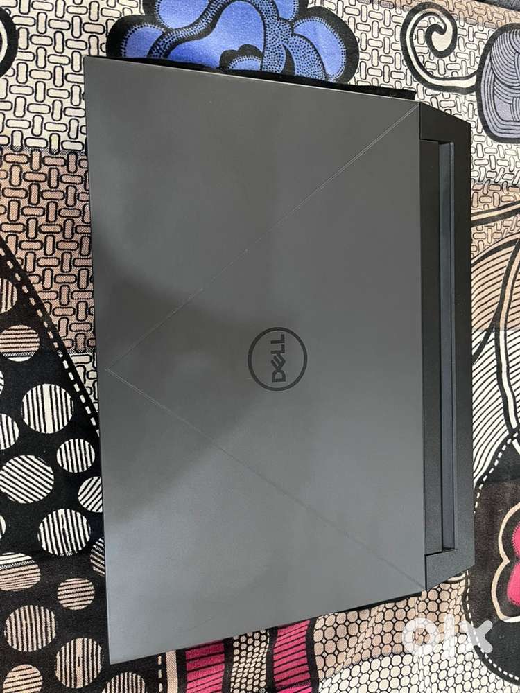 Dell G15 5530 Gaming laptop with accessories