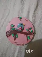 a canvas clay work with birds for gifting