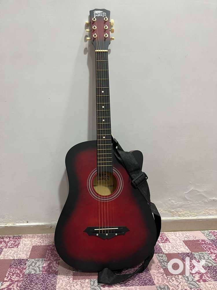 Red color Acoustic Guitar