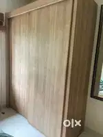 Wooden wardrobe with shelfes inside