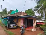 7 cent plot, 1000 sq.ft house, Keezhmad , good road access.