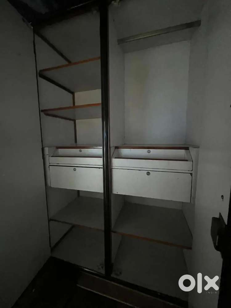 Bed with storage box, mattress, wooden cupboard, table and monitor