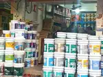 Salesman and manager in a paint showroom