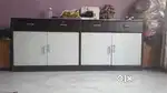 Single bed with mattress and a utility wardrobe