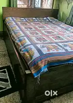Wooden double bed with storage