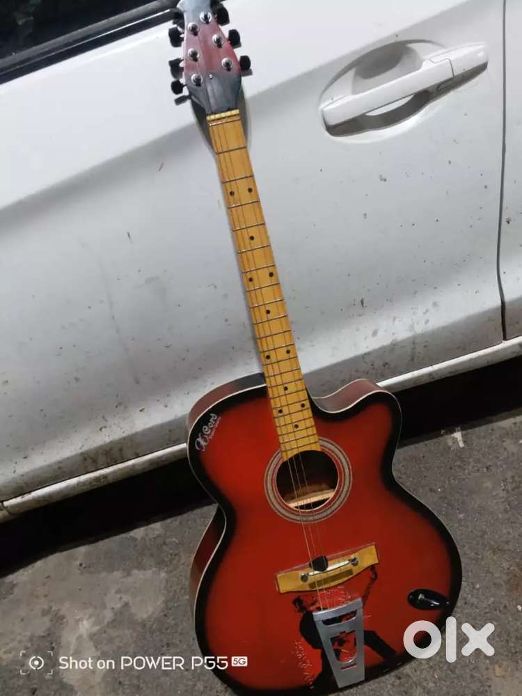 X cord acoustic guitar