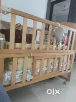Firstcry Kids cot bed with swing and mattress and side cushion