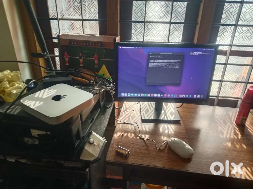 Mac mini with full computer accessories.