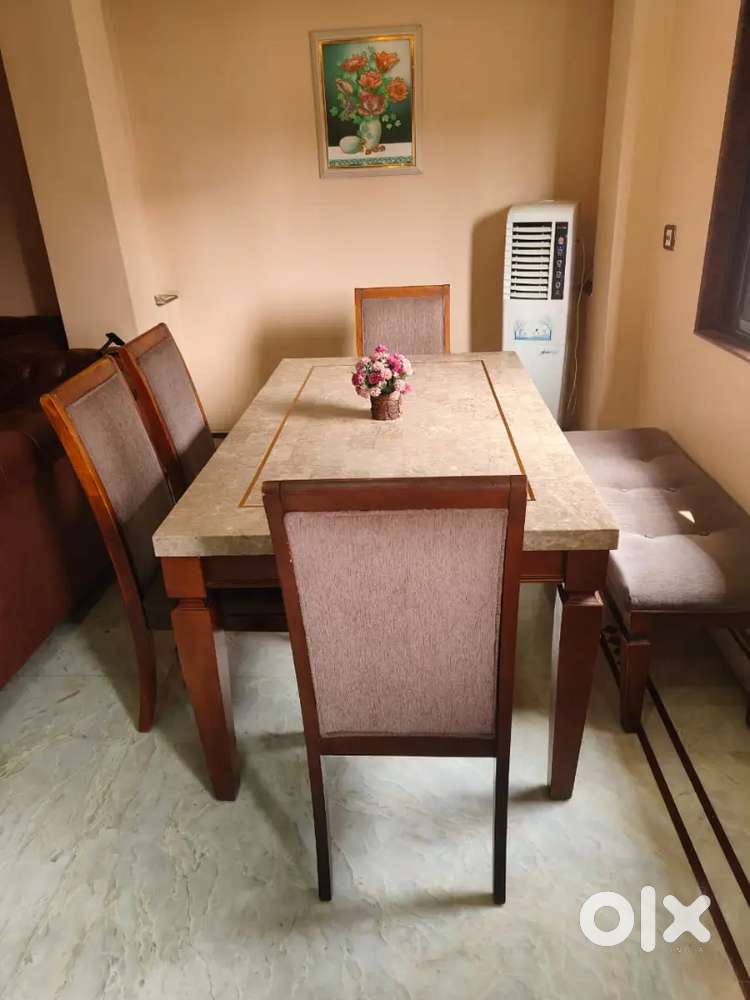 Dining table with 4 tables and 2 seater couch in good condition