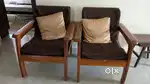 Wooden sofa with cushion and center table