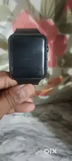 A black square digital watch