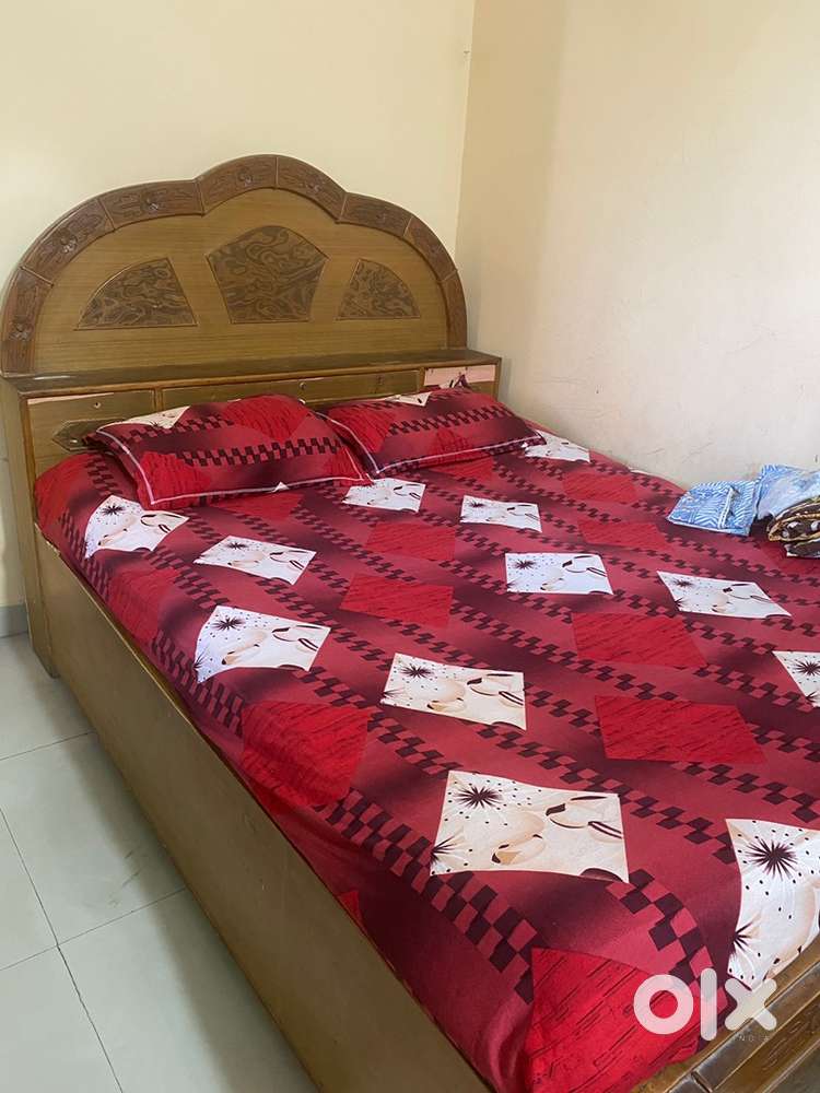 One dining table 6 sitter glass top and 1 queen size bed with storage