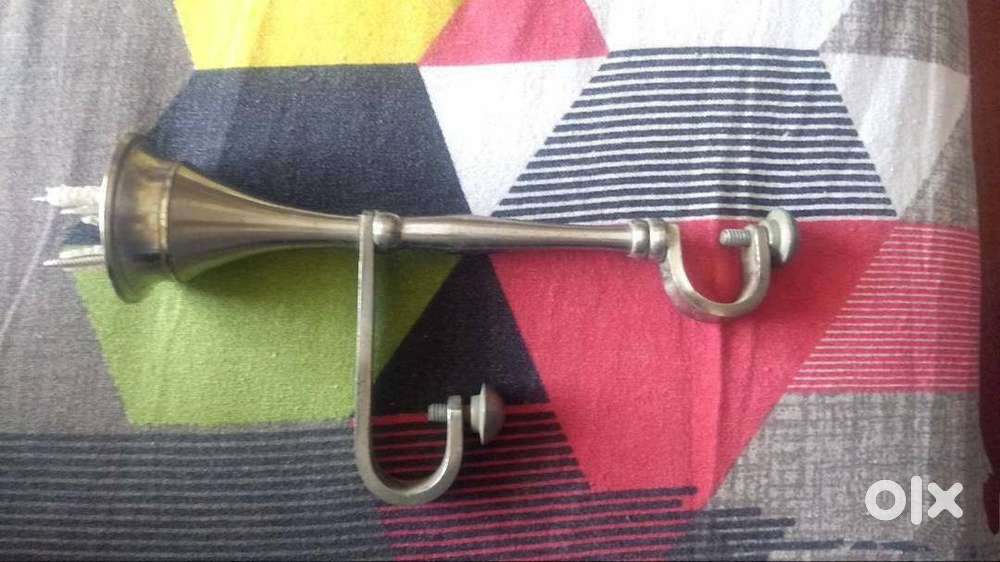 Metal Curtain Holder.