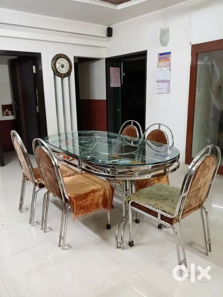 Jindal Stainless steel dinning table with Glass Top + 6 chairs