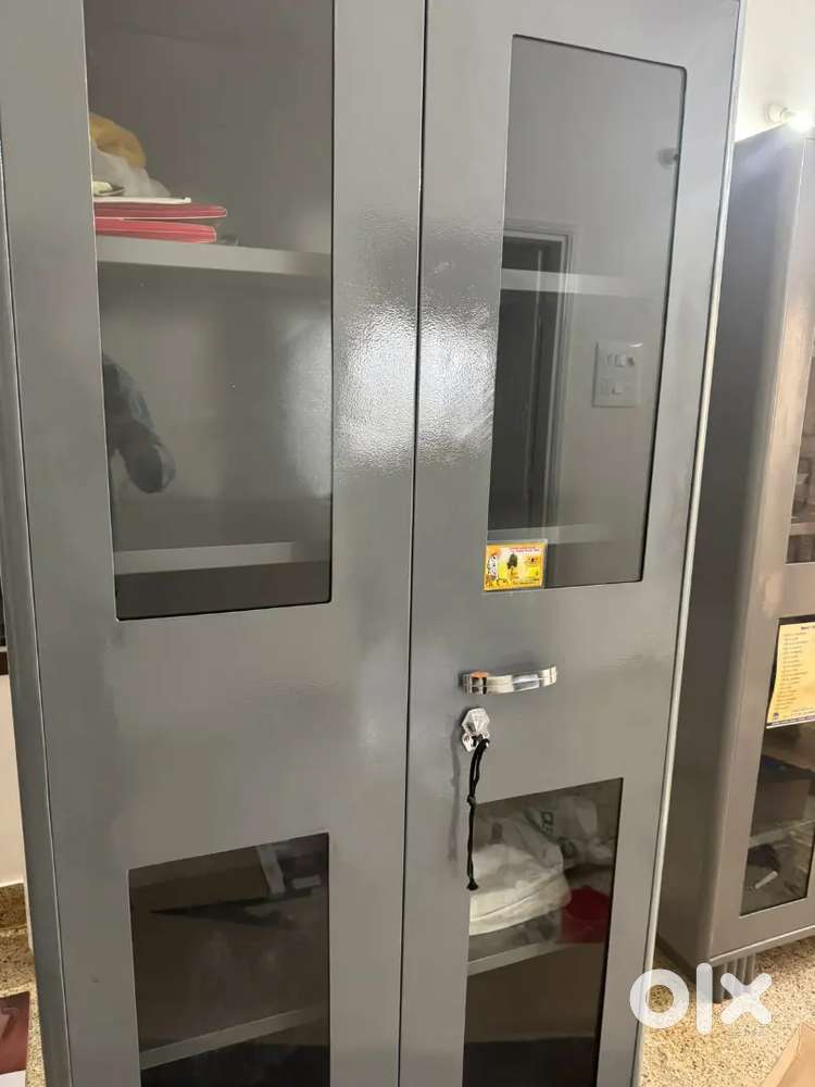 Brand new 2 door metal cupboard with lock and glass