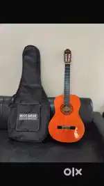 Like new condition guitar (orange) at a good price…