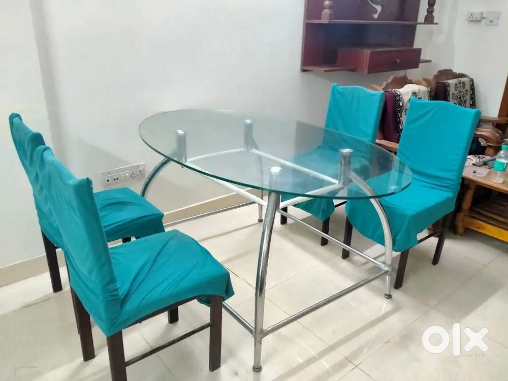 Godrej interio 4 seater Glass Dining table set with chairs