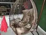 A swing with a stand and beautiful designs