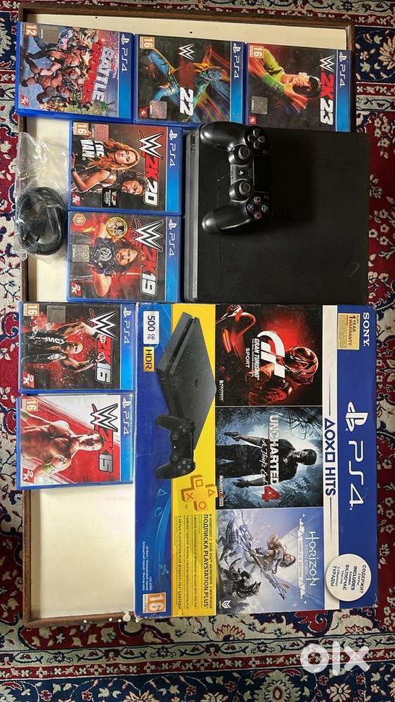 PS4 Slim 500GB + Original Controller + WWE 2K Collection (15–23)