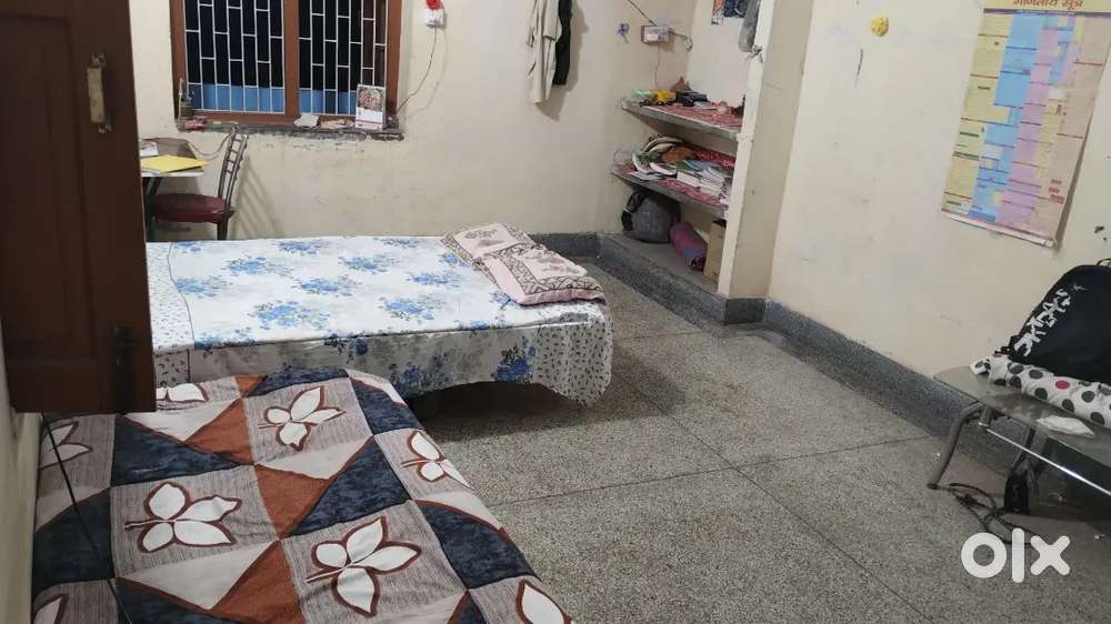 A room with single bathroom and kitchen