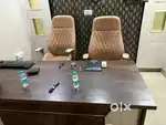 Office furniture setup with TV and couch