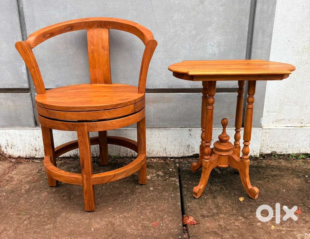 Antique teakwood revolving chair and a side table for urgent sale