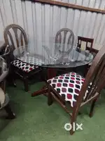 Round Glass-Topped Dining Table with Wooden Chairs (D4) On Rent