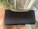 Black colour clutch with sling . No half price offers pls