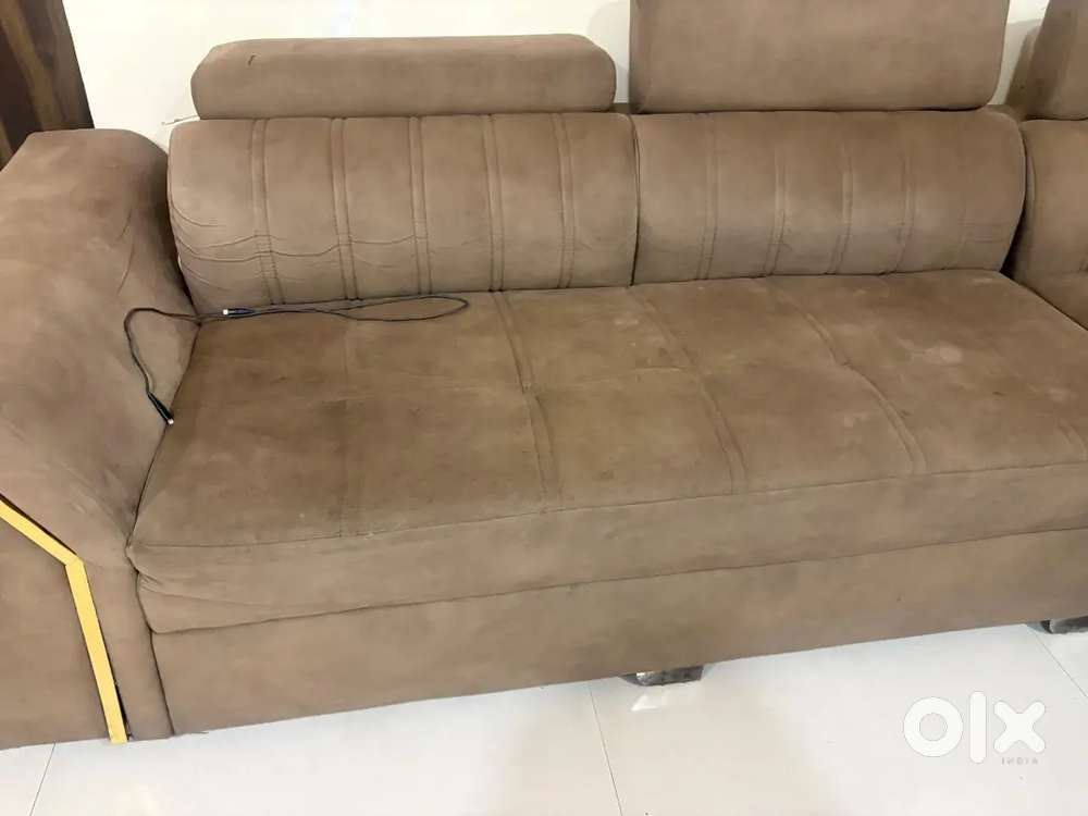 Brown head revolving sofa with puffies