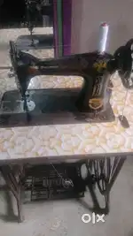 USHA SEWING MACHINE  WITH TABLE (interested people drop text only )