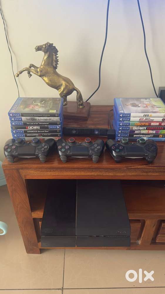 PS4 with 3 controllers, camera and 14 PS4 Games
