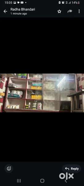 Three showcases with glass and one parlor mirror and a facial bed