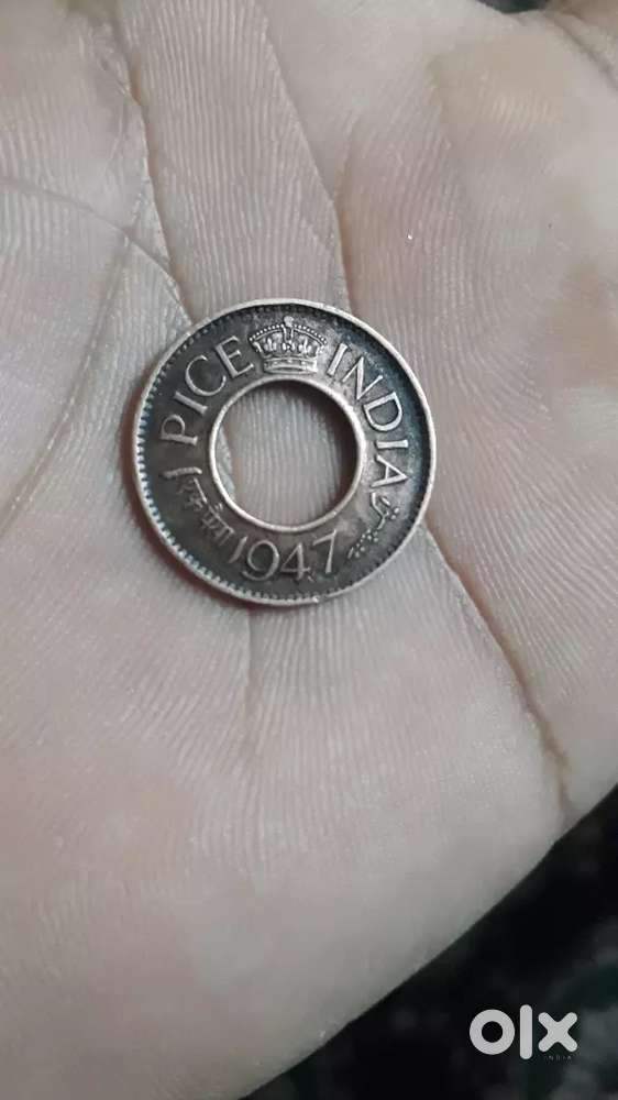 This is an: ANTIQUE COIN INDIAN 1PICEcoin in the year 1947