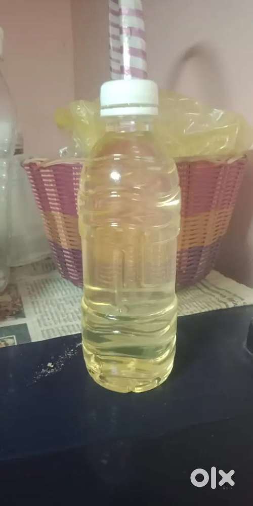 Volumetric oil bottle filling machine