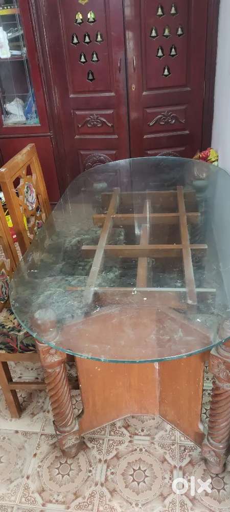 Glass top teek wood dinning table