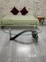 An Oval Shaped Glass Table
