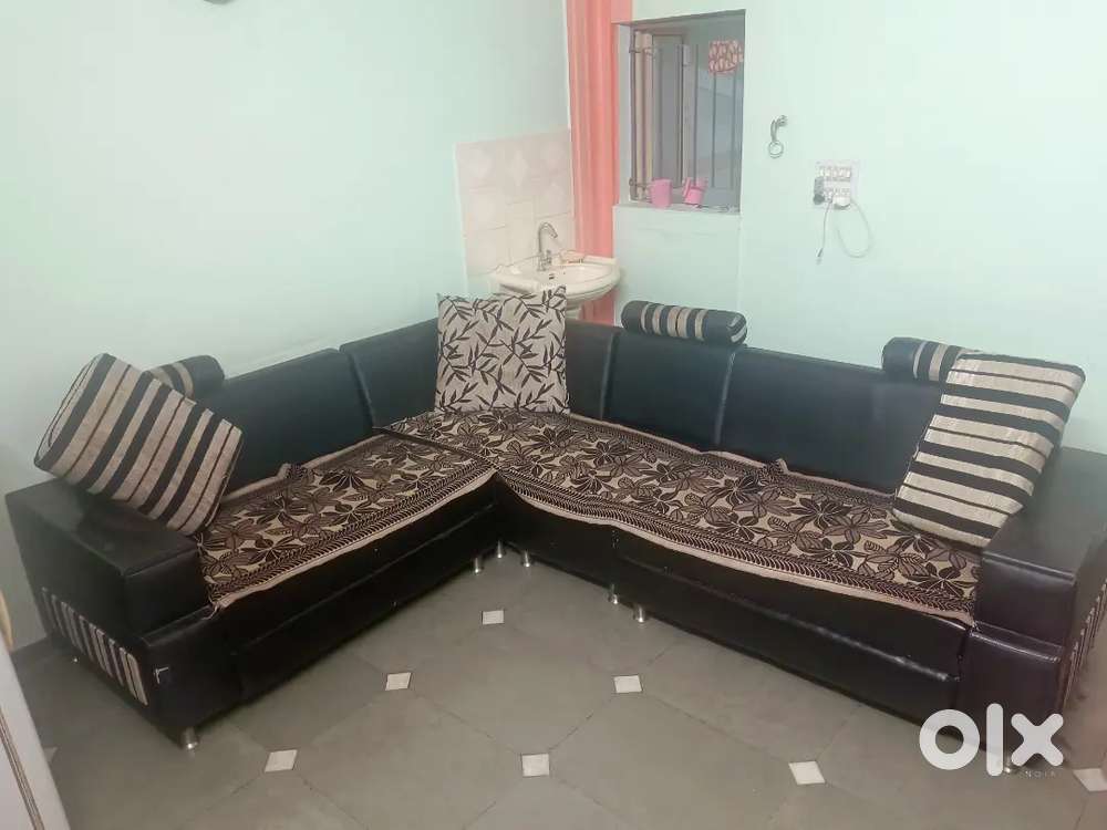 Comfortable sofa with sofa pillow and sofa cover