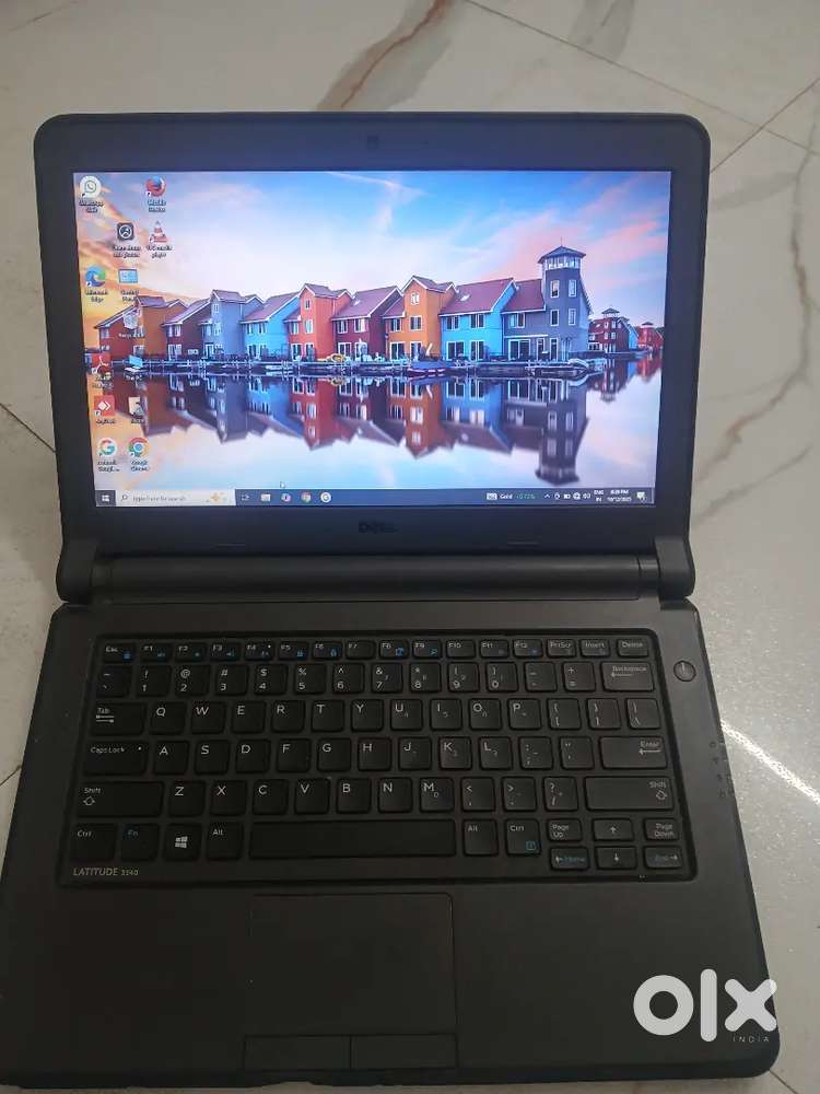 Dell Latitude 3340 laptop with charger