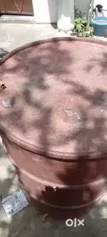 Iron drum with cover to keep wheat and rice.
