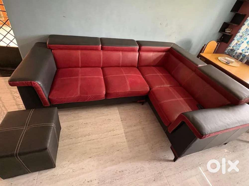 Rich red colour sofa with side sitting puffer