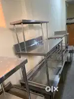 Used commercial restaurant kitchen equipment table with pickup counter
