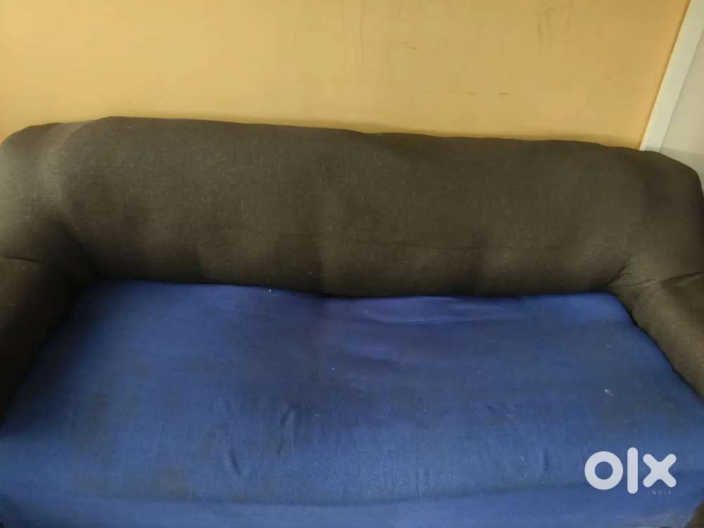 Blue sofa in  good condition with covers