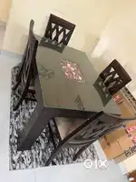 4 seater dining table with chair and carpet