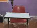 Desk red in colour used in classes