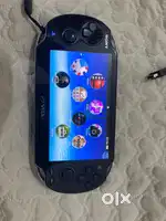 Sony PS Vita (PCH-1002 OLED) + 8gb memory card & accessories
