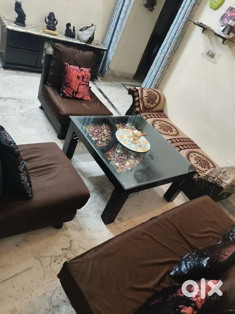 Good condition sofa with table with 2 set covers