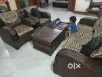 5 seater sofa with glass top center table in good condition for sale