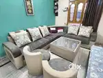 L-Shaped 8 seater Sofa Set  + Glass Table, Cushions & 2 Round Puffs