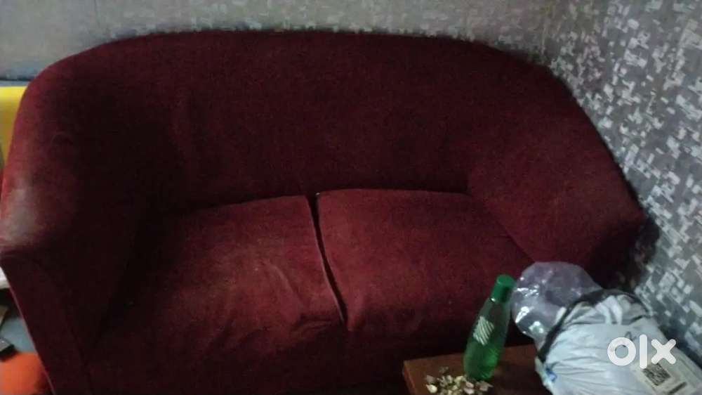 Red two seater sofa
