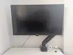 LG 27 inch monitor with built in speakers and adjustable swing arm.
